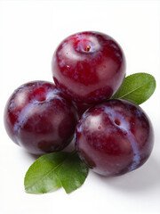 Fototapeta premium Fresh Ripe Plums With Green Leaves On A Clean White Background, Close-Up Shot For Food Or Healthy Eating Concepts