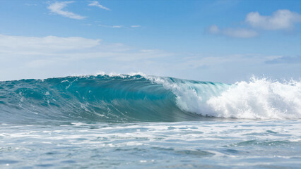 Powerful Ocean Wave Crashing In Clear Blue Water Under A Sunny Sky, Capturing The Dynamic Motion Of Nature