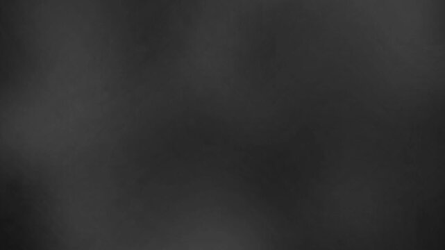 An dark grey background with subtle, slow-moving light and shadow patterns. The diffused, grainy texture creates a smooth, minimalist aesthetic, perfect for overlays or understated visual effects