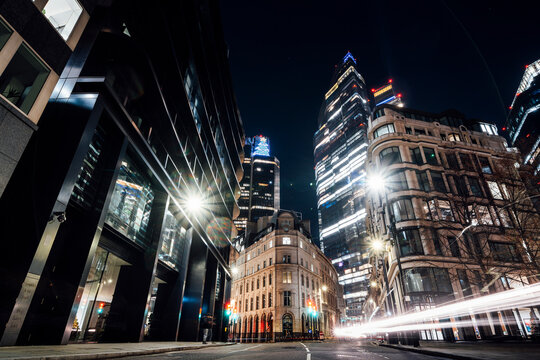 Night street view of illuminated skyscrapers in London's financial district