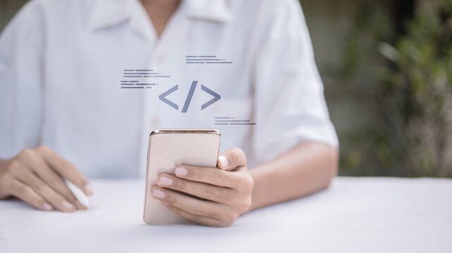 Mobile App Development and Programming Concept with Code Symbol on Smartphone