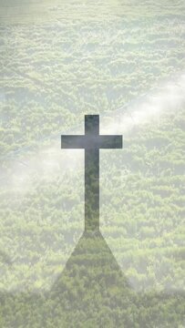 Vertical video: Beam moving, cross shape holding, fog drifting, shadow growing, revealing tower