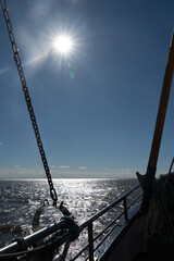 View of the sea from a fishing boat with sun
