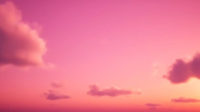 A pink sky with soft, blurred clouds. Hues transition from deep pink to peach as the sun sets, creating a tranquil atmosphere