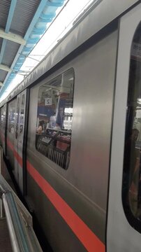New Delhi, India, April 16 2025 - Delhi Metro train arriving at Jhandewalan metro station in New Delhi, India, Asia, Public Metro departing from Jhandewalan station