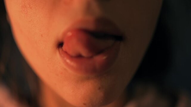 Intimate shot of woman practicing breathy vocal exercises