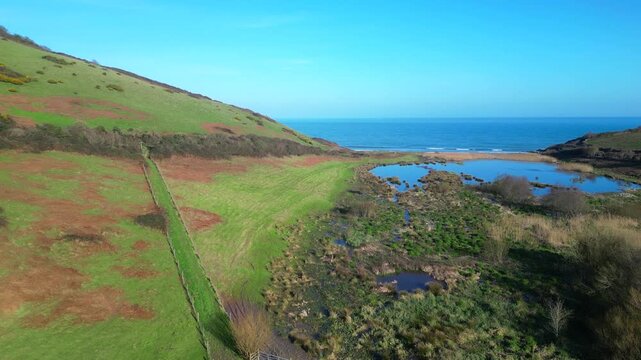 Man Sands, South Devon, England: DRONE VIEWS: A secluded beach on the South Devon coast just south of Brixham. The lagoon behind the beach is a haven for birds and grass snakes.