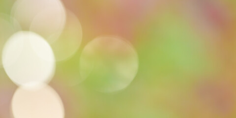 Abstract blurred background with white bokeh circles on green yellow pink. Glowing effect as autumn...