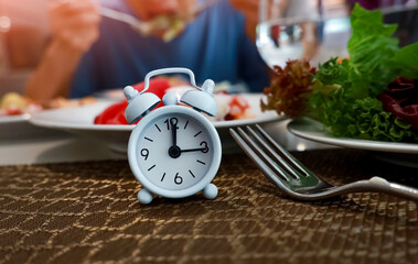 Healthy Meal Timing with white  Alarm Clock Waiting for the IF Meal