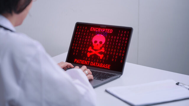 Stressed doctor facing serious digital healthcare data breach on laptop screen displaying ominous ransomware skull alert locking patient records