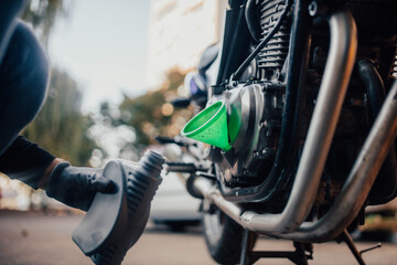 Changing motorcycle engine oil and adding technical fluids