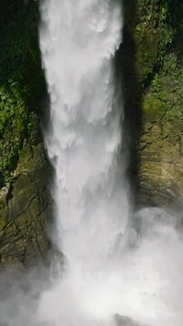 Water mist from Hikong Bente Falls in Lake Sebu. Mindanao, Philippines. Vertical view and Slow motion. .