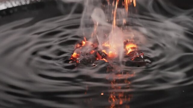 Sparks ignite liquid creating ripples