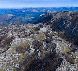 Obraz premium Aerial view from a drone of Mount Mortillano in the karst massif of the Sierra de Hornijo. Collados del Asón Natural Park. Soba Valley. Pasiegos Valleys. Cantabria. Spain. Europe