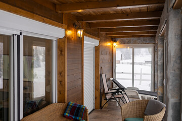 Cozy interior of a modern mountain lodge terrace.