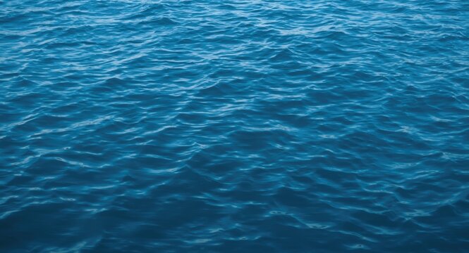 Peaceful blue water texture with gentle wave ripples providing a calm and serene backdrop