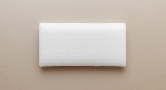 White bubble cushioning wrap displaying subtle panel texture background
