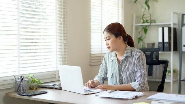 Bored sleepy asian lady sitting at desk with laptop, tired young female feeling drowsy, lazy and unmotivated work, boring job, 