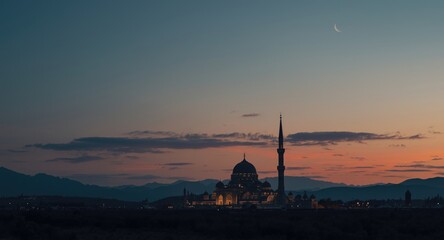 Obraz premium Radiant crescent moon and glowing clouds over mosque silhouetted on mountain for Ramadan