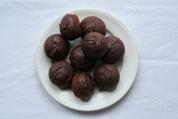 Chocolate Muffins on a Plate &ndash; Homemade Sweet Dessert Concept