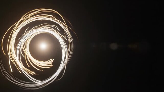 Abstract Circular Light Streaks on a Dark Background with Lens Flare