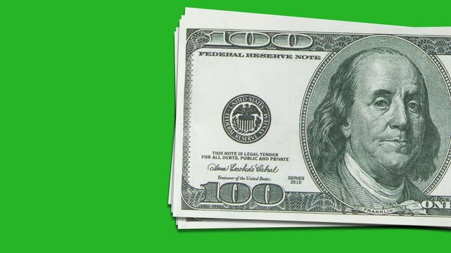 A stack of hundred-dollar bills, appearing on a chromakey background, the concept of cash, financial transactions, and banking operations. 4K