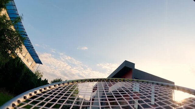 Close-up action of player striking shuttlecock in badminton match