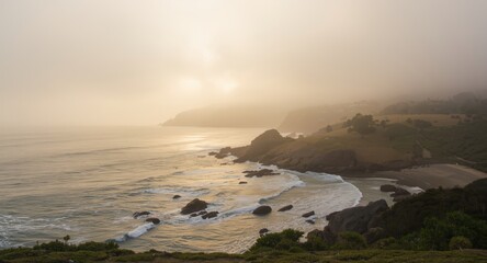 Obraz premium Misty morning light gently touching a coastal landscape