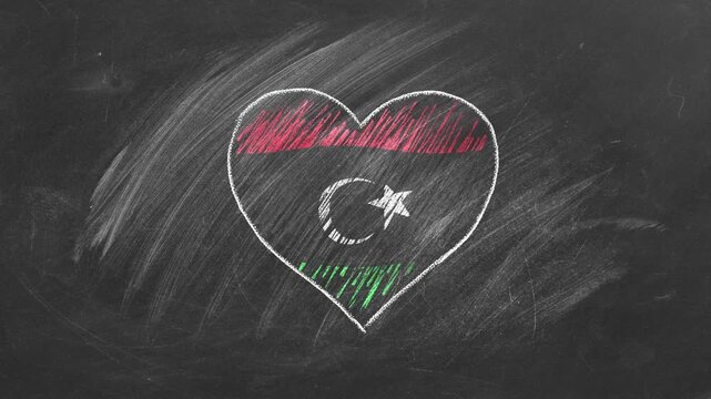 National flag of Libya in heart shape  drawn with colored chalk on a blackboard