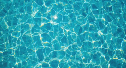 Obraz premium Sunlit blue pool water with a visible tiled floor captured from above in a summery ambiance