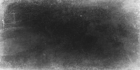 Obraz premium Dark black and white grunge background with a textured old wall surface and vintage gray paper pattern for a blank dirty backdrop