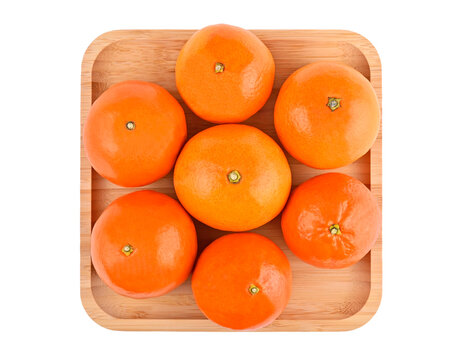 Mandarin on bamboo plate, flat lay