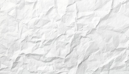 Obraz premium A crumpled white paper texture with deep creases and folds
