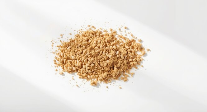 Terminalia arjuna seed herbal powder spread evenly on a clean white surface