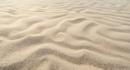 Obraz premium Natural sand grain texture featuring smooth patterns and soft daylight for vacation backdrop copy space