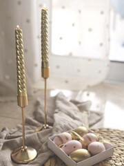 Golden Twisted Candles With Pastel Easter Eggs