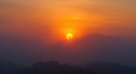 Obraz premium Bright sunrise shining through misty dawn with wide copy space