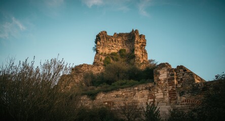 Obraz premium Dilapidated vintage tower ruins as historical heritage travel backdrop with copy space included
