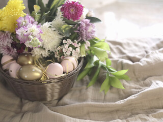 Spring Easter Basket With Pastel Eggs And Flowers