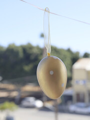 Hanging Golden Easter Egg Decoration On A Ribbon