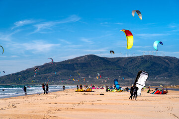 Kitesurfers and tourists on beach in Tarifa, active holidays in Spain, Andalusia. © Tomasz