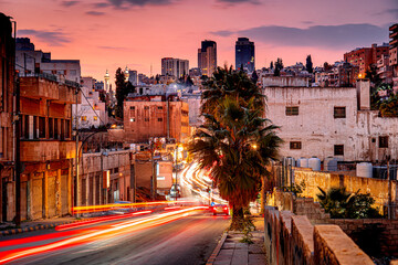 Long exposure of street in Amman, car lights at night in Jordan, capital in the Middle East at night. © Tomasz