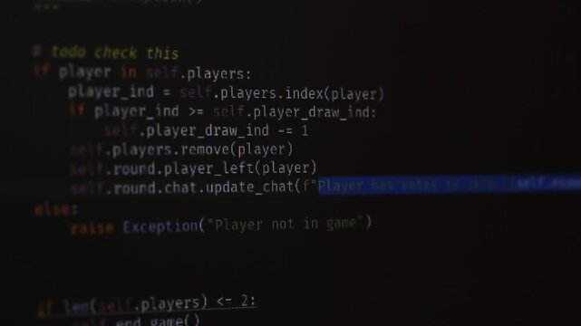 The program code on the monitor screen is close, programmer