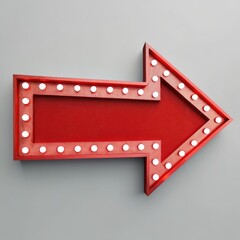 A red arrow sign with white lights on a gray background