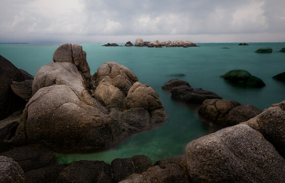 Scenic tropical seascape with giant granite boulders and clear water at Bintan Island, Indonesia