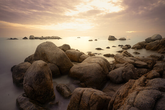 Scenic tropical seascape with giant granite boulders and clear water at Bintan Island, Indonesia