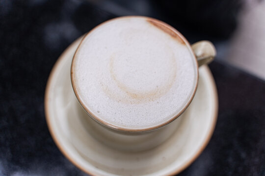 Close-up overhead view of a cappuccino on a table