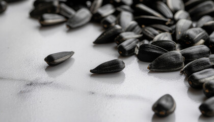 Black sesame seeds on marble surface