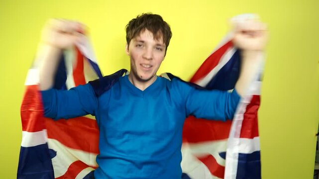 A football fan rejoices at his team's victory and shouts hurray.