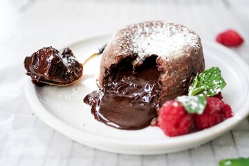 Homemade Chocolate molten lava cake served with raspberries and powdered sugar © vm2002
